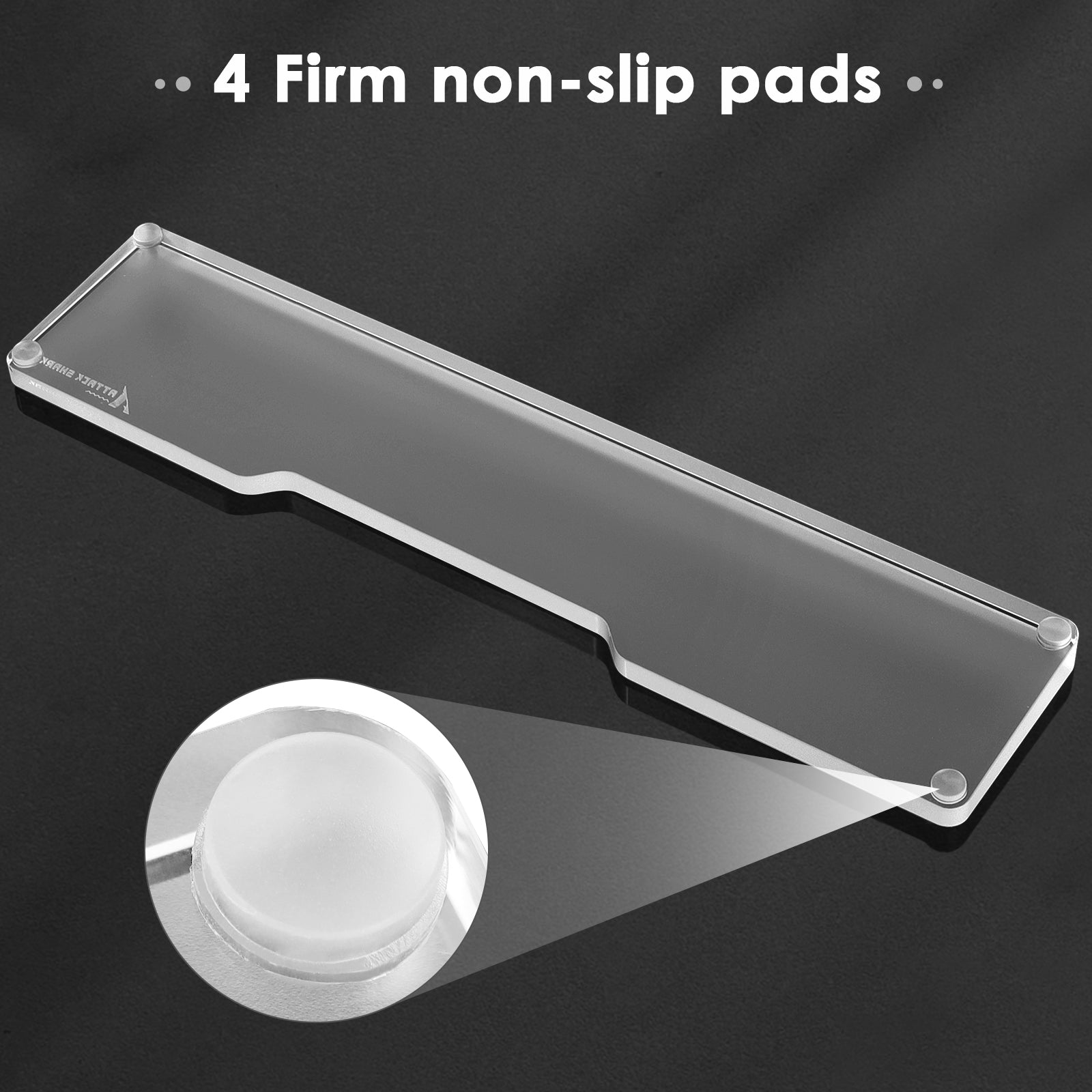 Close-up of acrylic wrist rest highlighting four firm non-slip pads.